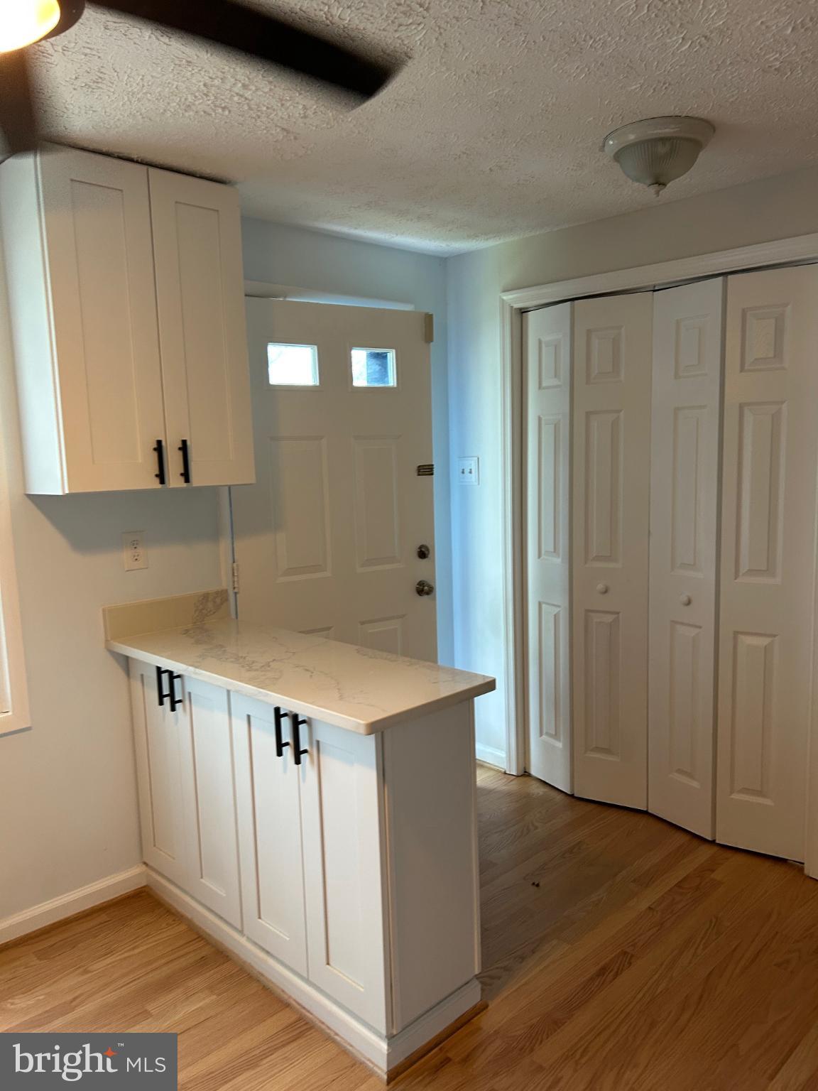 8317 Brookvale Court Springfield, VA 22153 - Photo 3 of 15 a view of kitchen with furniture and wooden floor
