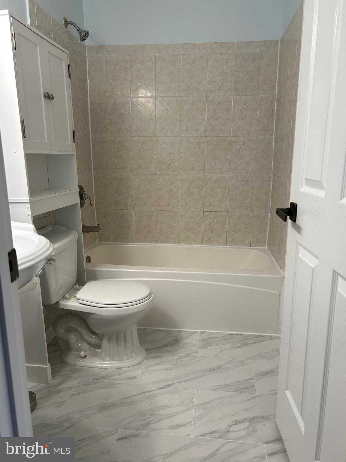 8317 Brookvale Court Springfield, VA 22153 - Photo 9 of 15 a bathroom with a toilet and a shower