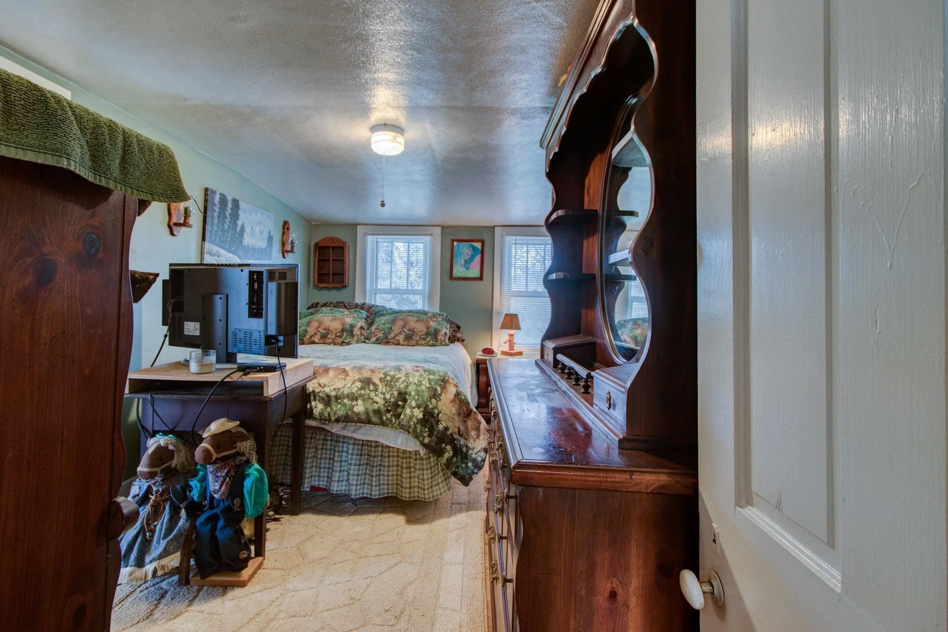 296 Archway Road Blue Ridge, VA 24064 - Photo 15 of 28 a bedroom with a bed and walk in closet