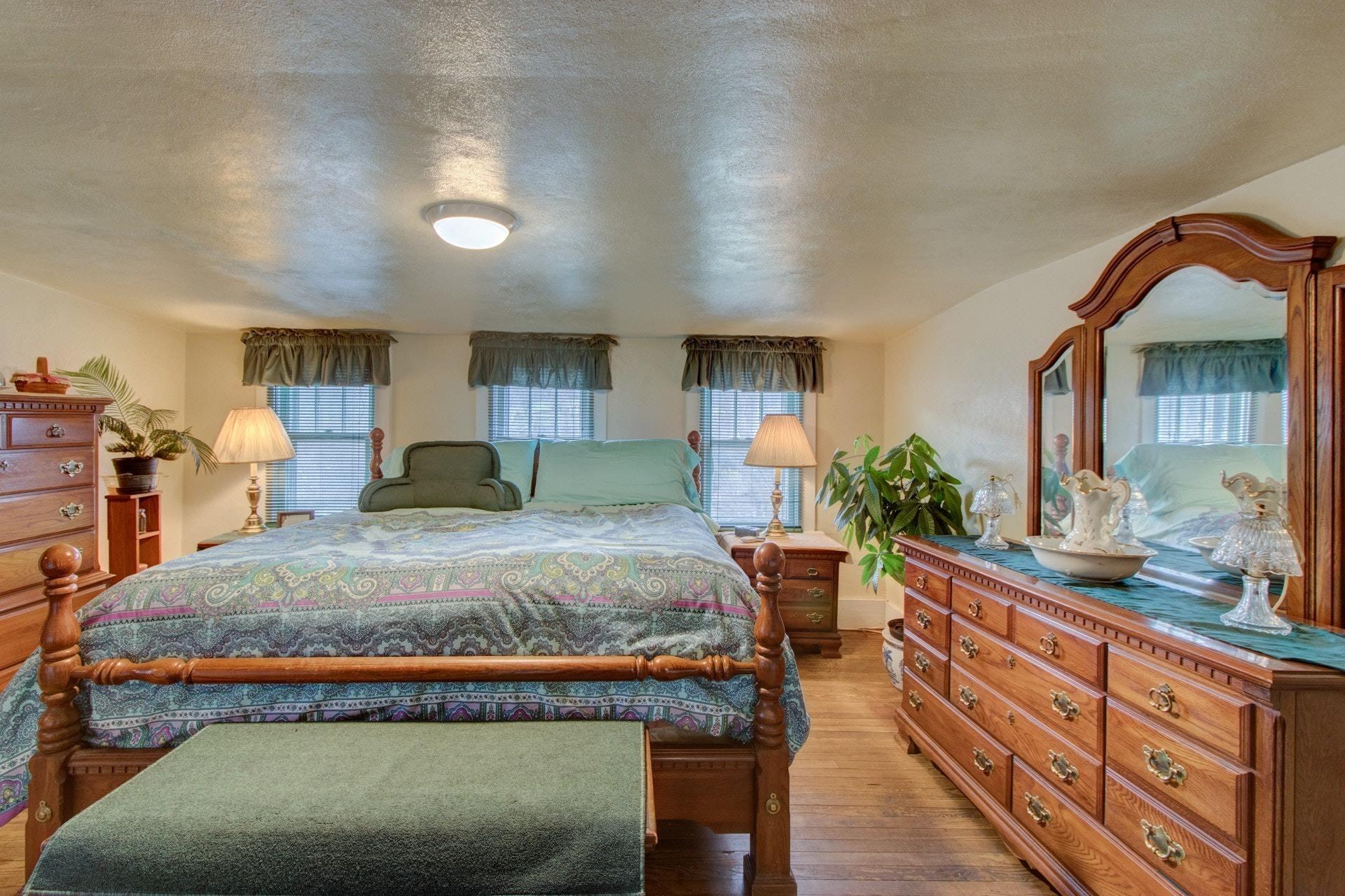 296 Archway Road Blue Ridge, VA 24064 - Photo 19 of 28 a bed room with a bed and a dresser