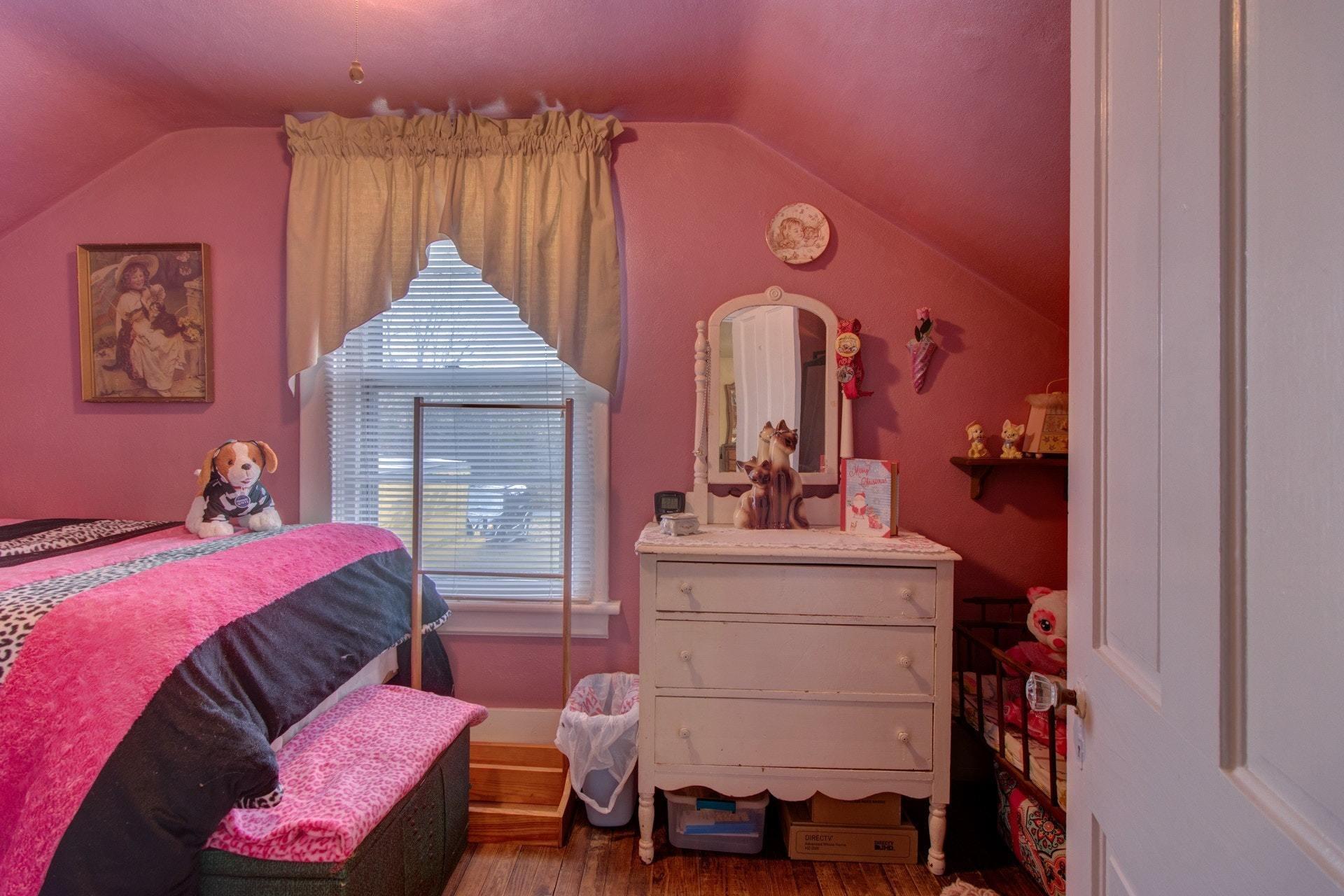296 Archway Road Blue Ridge, VA 24064 - Photo 20 of 28 a bedroom with a bed and a mirror