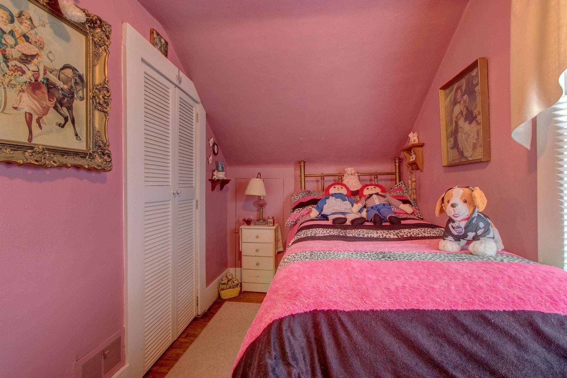 296 Archway Road Blue Ridge, VA 24064 - Photo 21 of 28 a bedroom with a bed and a mirror