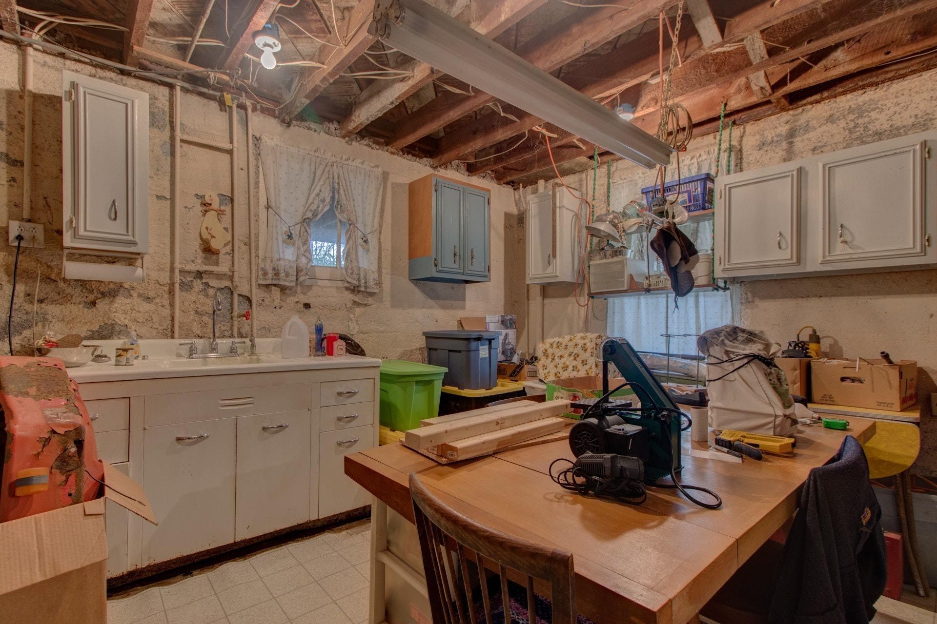 296 Archway Road Blue Ridge, VA 24064 - Photo 22 of 28 a view of a kitchen with a sink a table and chairs