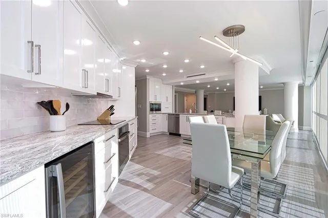 a view of a dining room with furniture window and outside view
