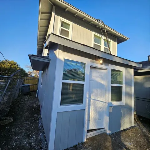a front view of a house with stairs