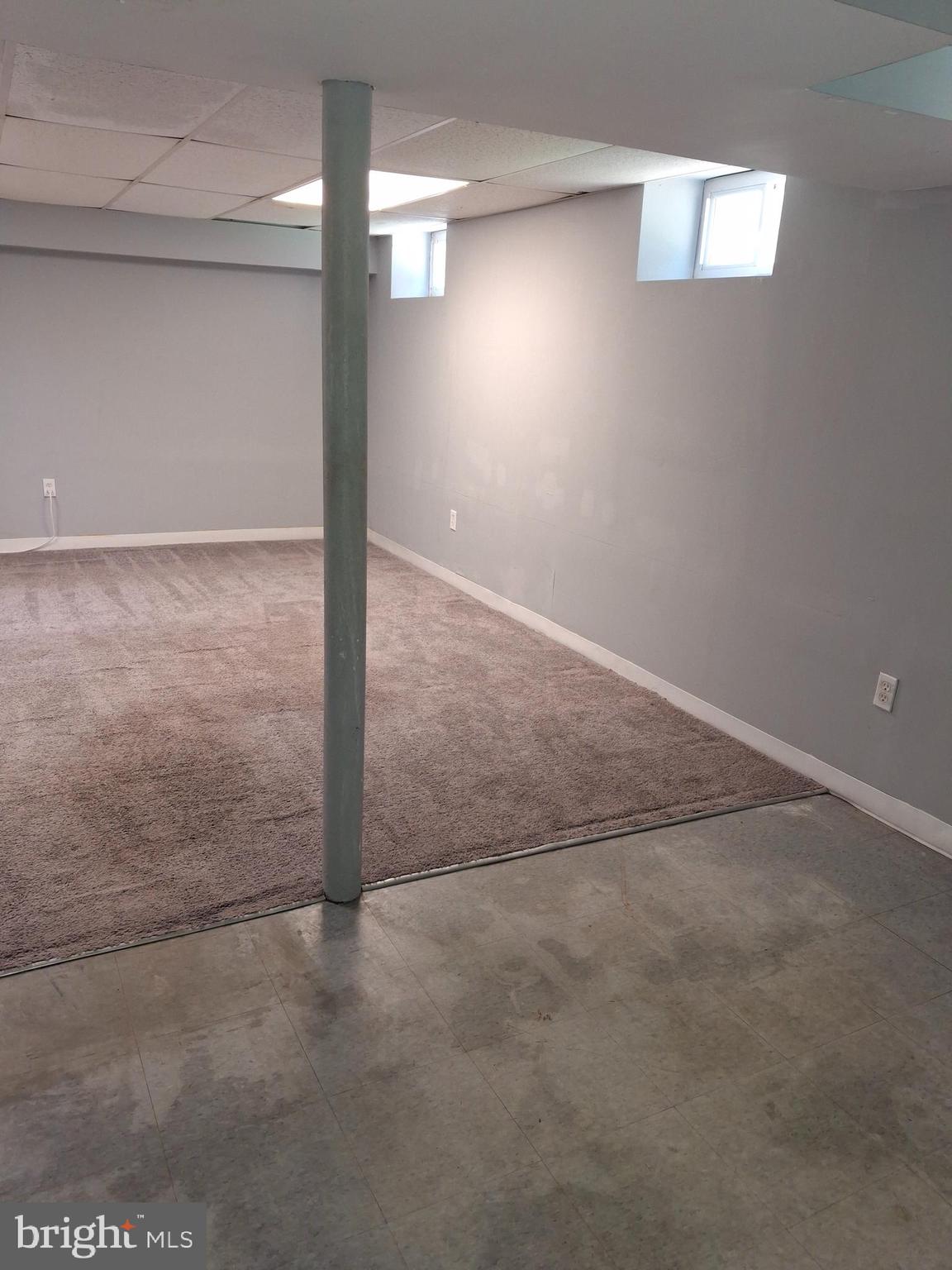 3906 Rosecrest Avenue Baltimore, MD 21215 - Photo 18 of 23 an empty room with windows