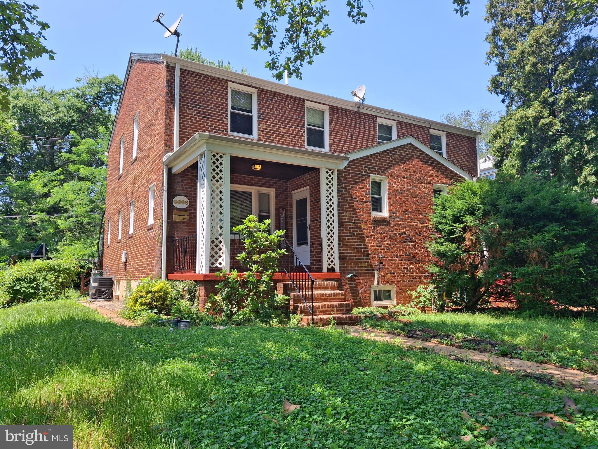 3906 Rosecrest Avenue Baltimore, MD 21215 - Photo 2 of 23 a front view of a house with a yard