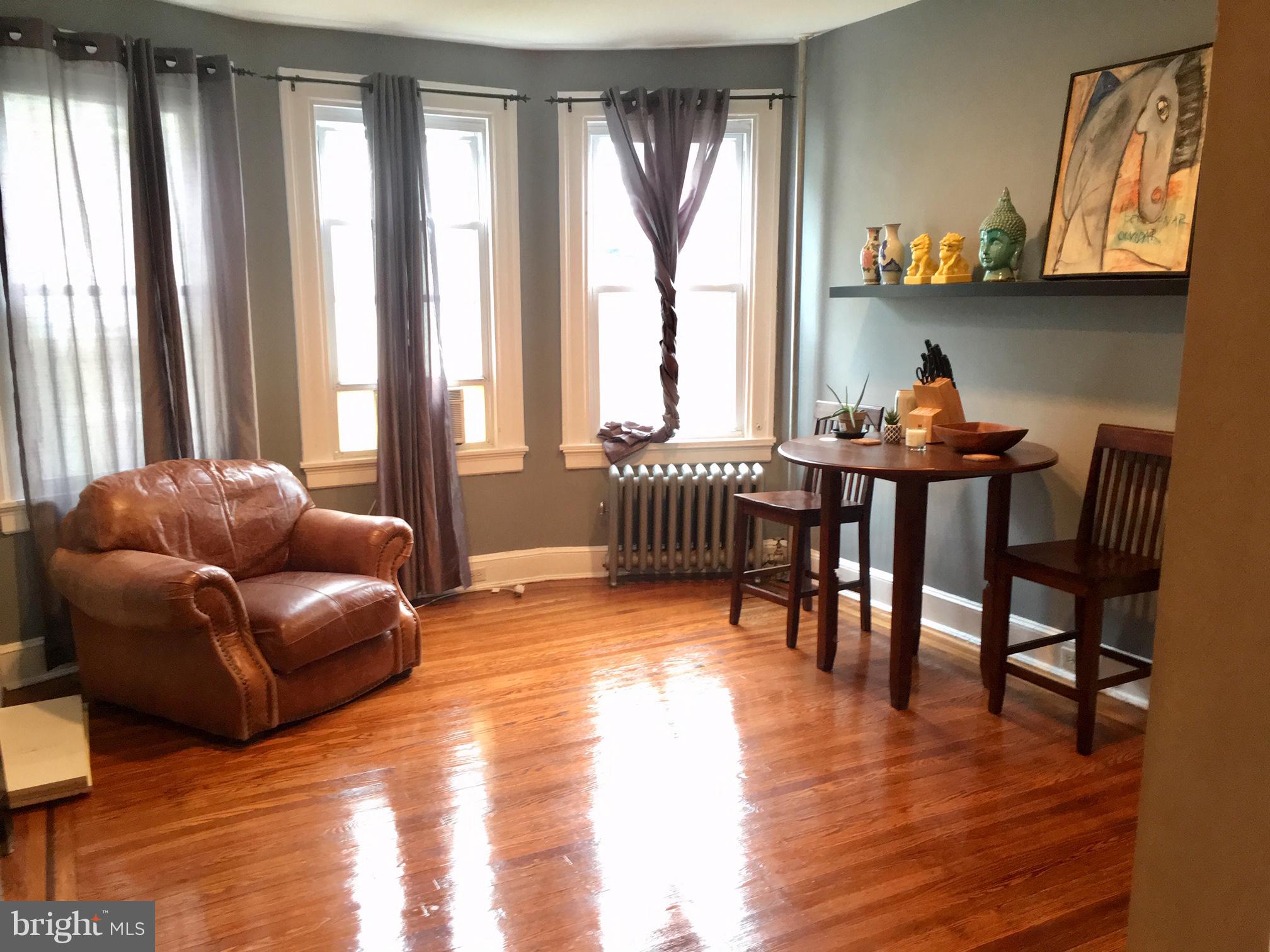 3704 Chatham Road Baltimore, MD 21215 - Photo 2 of 28 a living room with furniture and a wooden floor