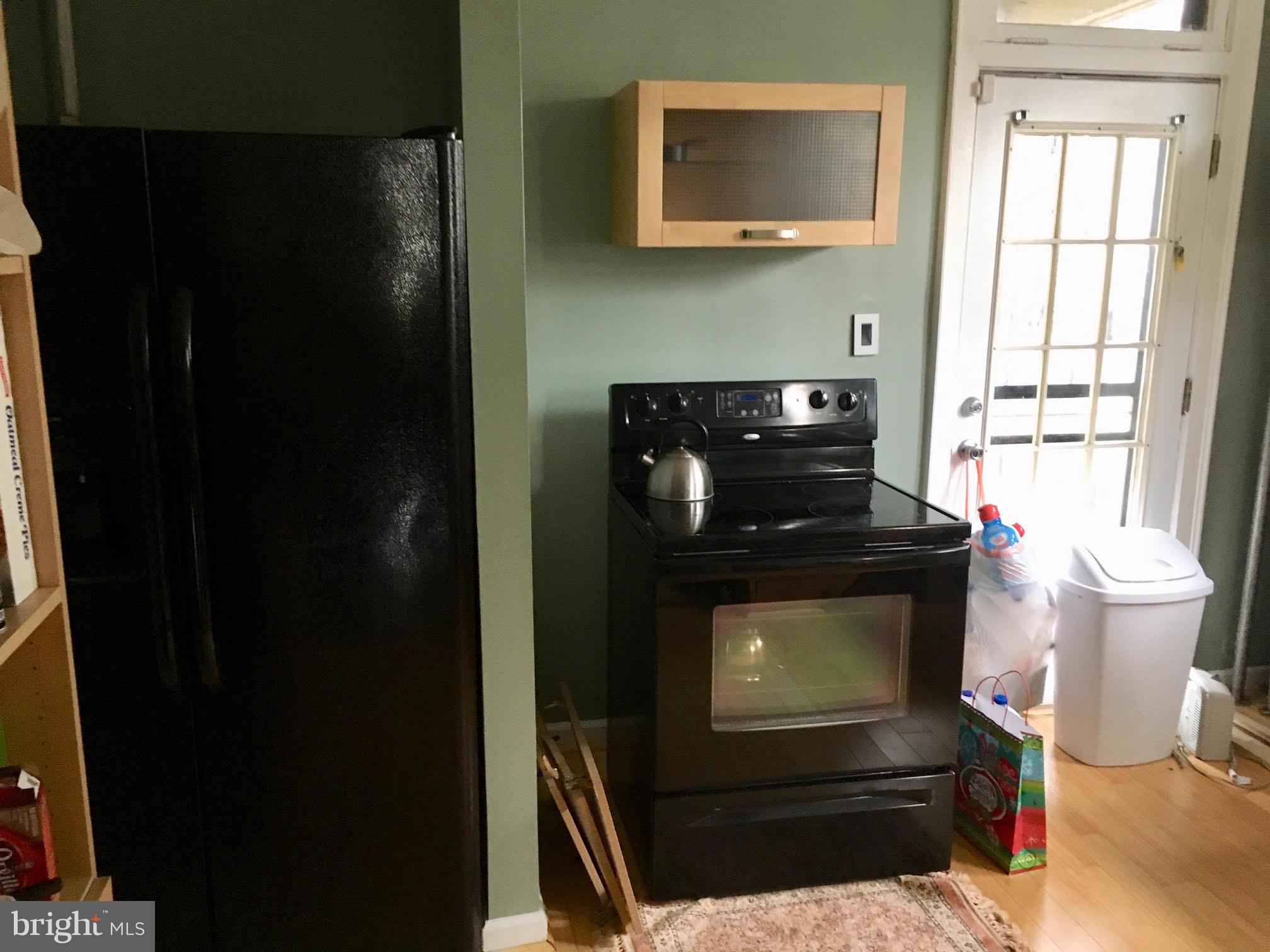3704 Chatham Road Baltimore, MD 21215 - Photo 11 of 28 a living room with a fireplace and a window