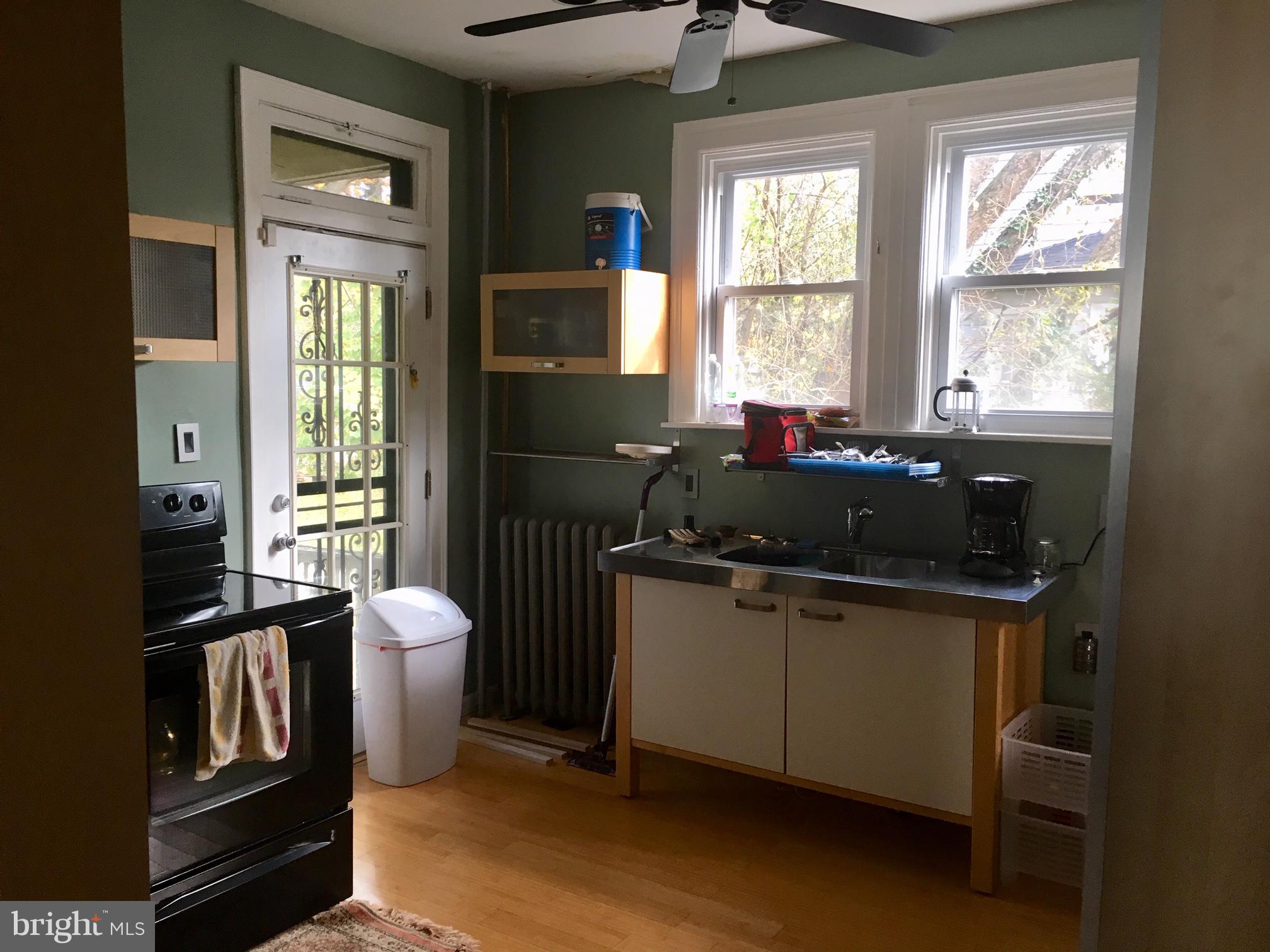3704 Chatham Road Baltimore, MD 21215 - Photo 12 of 28 a kitchen with a sink appliances and cabinets