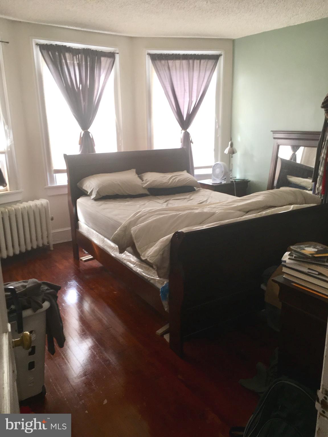 3704 Chatham Road Baltimore, MD 21215 - Photo 15 of 28 a bedroom with a bed and a window