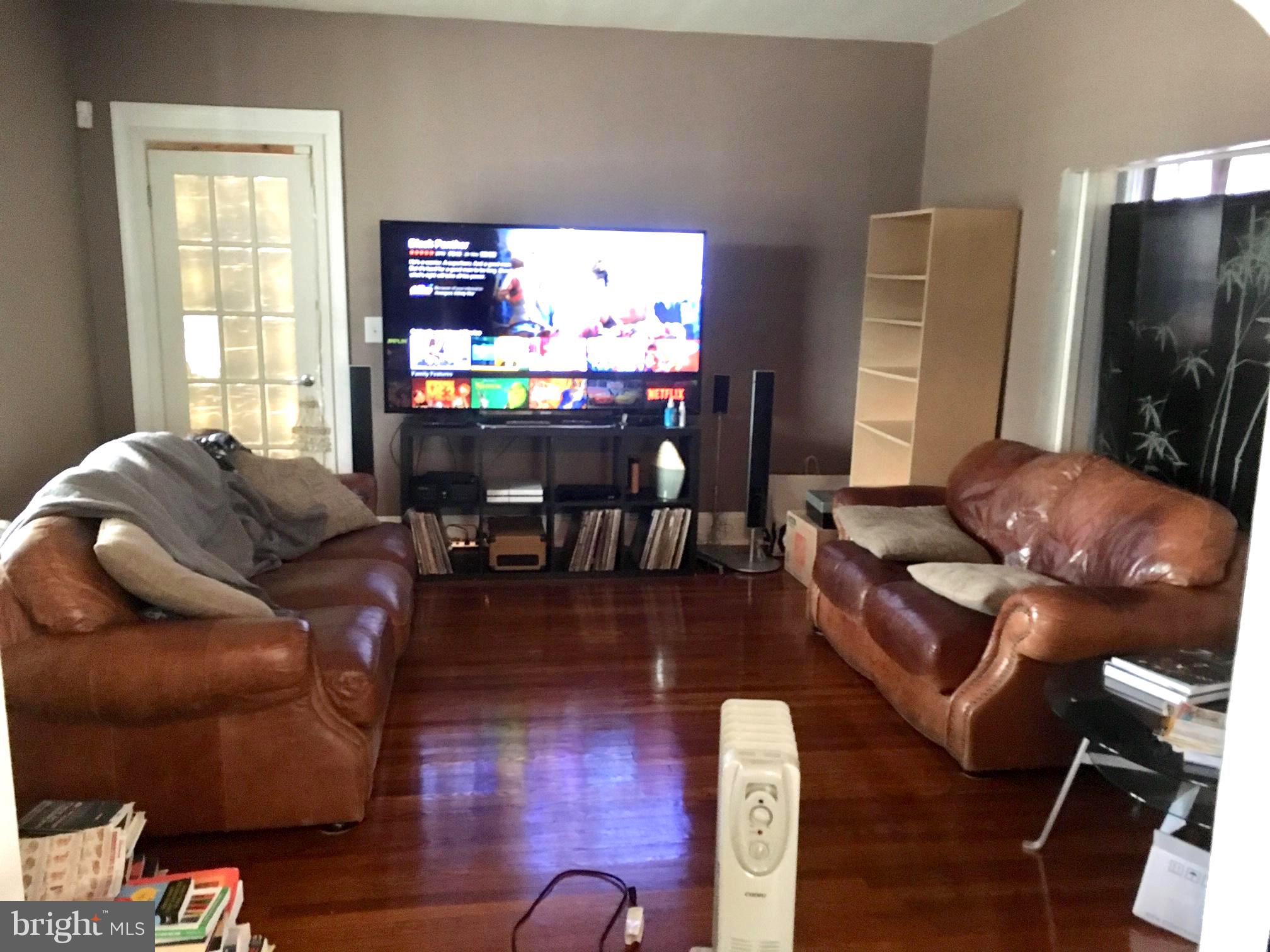3704 Chatham Road Baltimore, MD 21215 - Photo 5 of 28 a living room with furniture and a flat screen tv