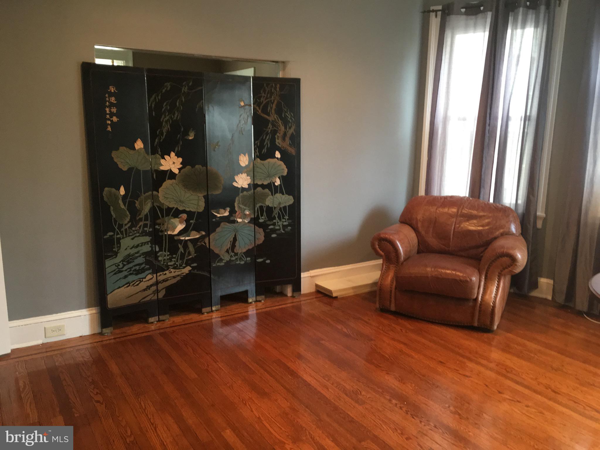 3704 Chatham Road Baltimore, MD 21215 - Photo 6 of 28 a living room with furniture and wooden floor