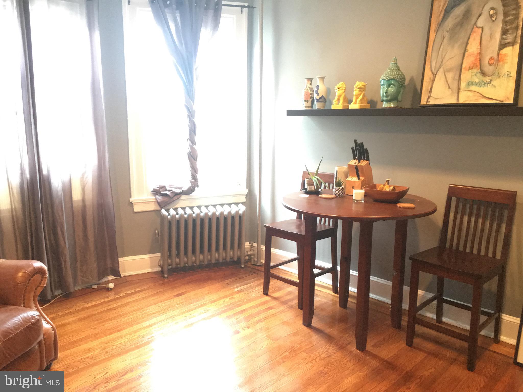 3704 Chatham Road Baltimore, MD 21215 - Photo 7 of 28 a view of a dining room with furniture and a window
