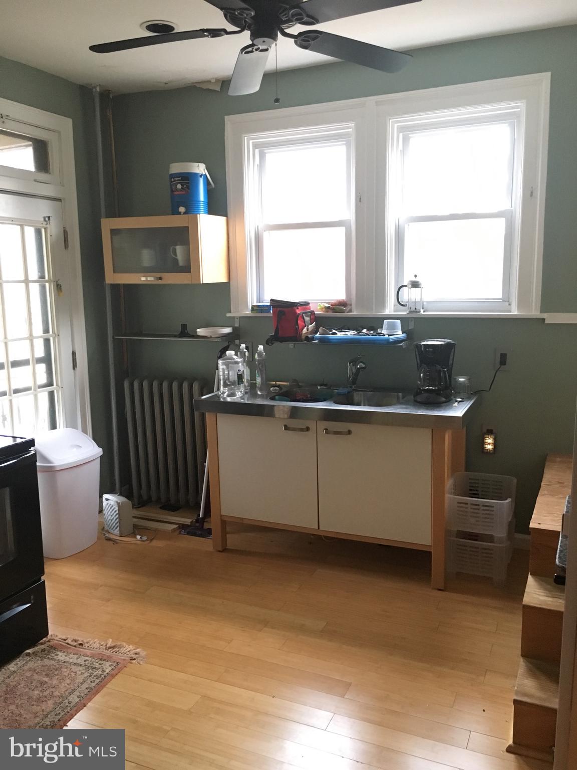 3704 Chatham Road Baltimore, MD 21215 - Photo 10 of 28 a kitchen with a sink stove and window