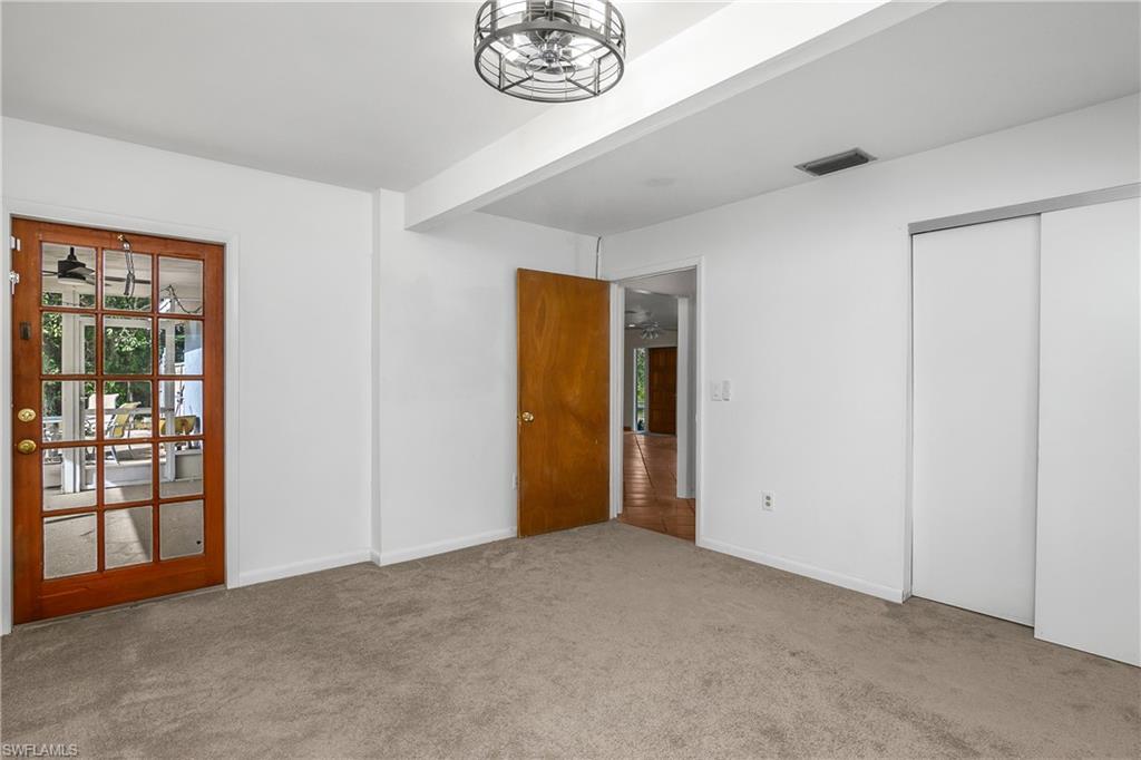 48 Republic Drive Naples, FL 34112 - Photo 12 of 29 Main suite with door leading to Lanai