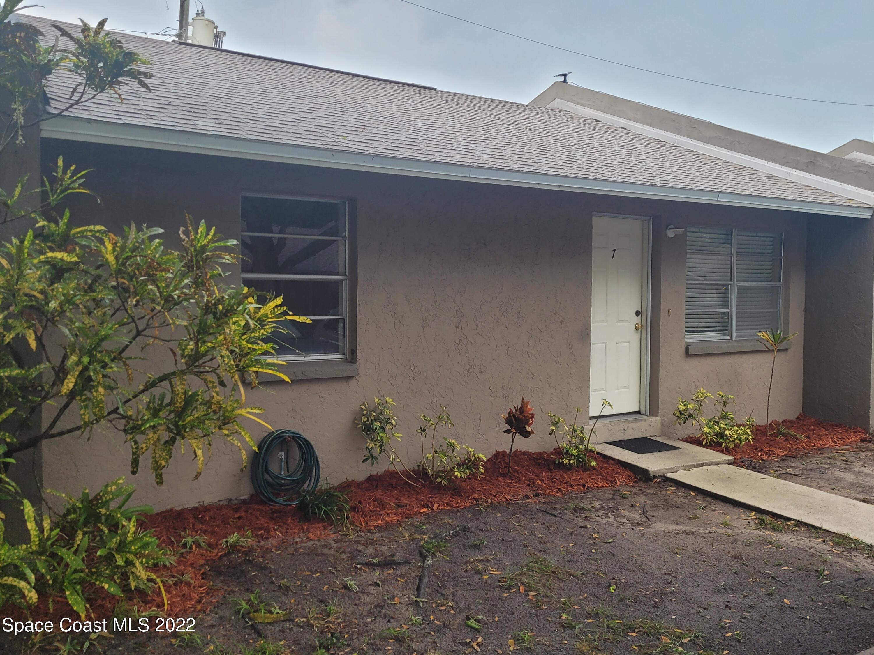 3225 Murrell Road, Unit 7 Rockledge, FL 32955 - Photo 1 of 9 a front view of a house