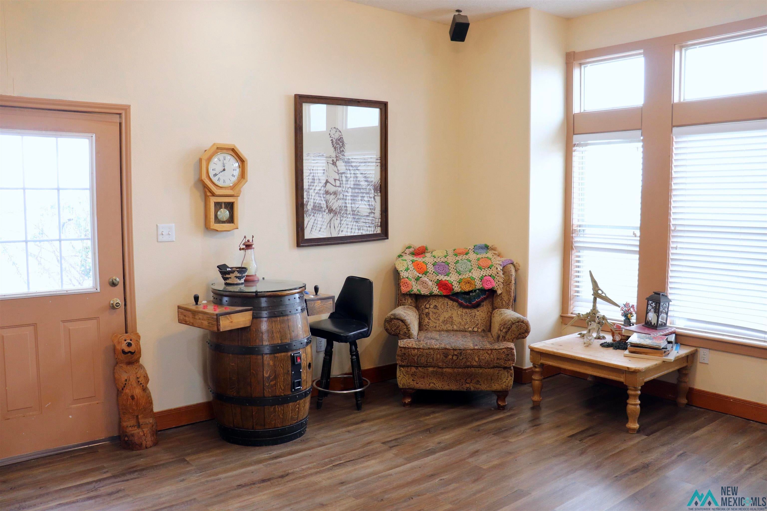 845 South Roosevelt Road South Portales, NM 88130 - Photo 9 of 47 Sitting room with wood finished floors and plenty of natural light