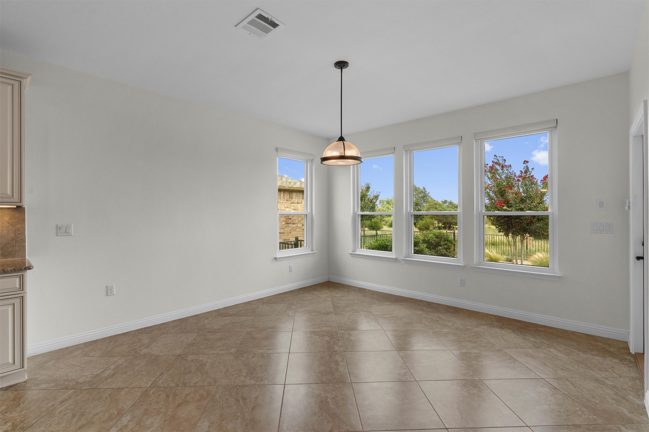 205 McKittrick Ridge Road Georgetown, TX 78633 - Photo 15 of 37 a view of a room with windows and chandelier