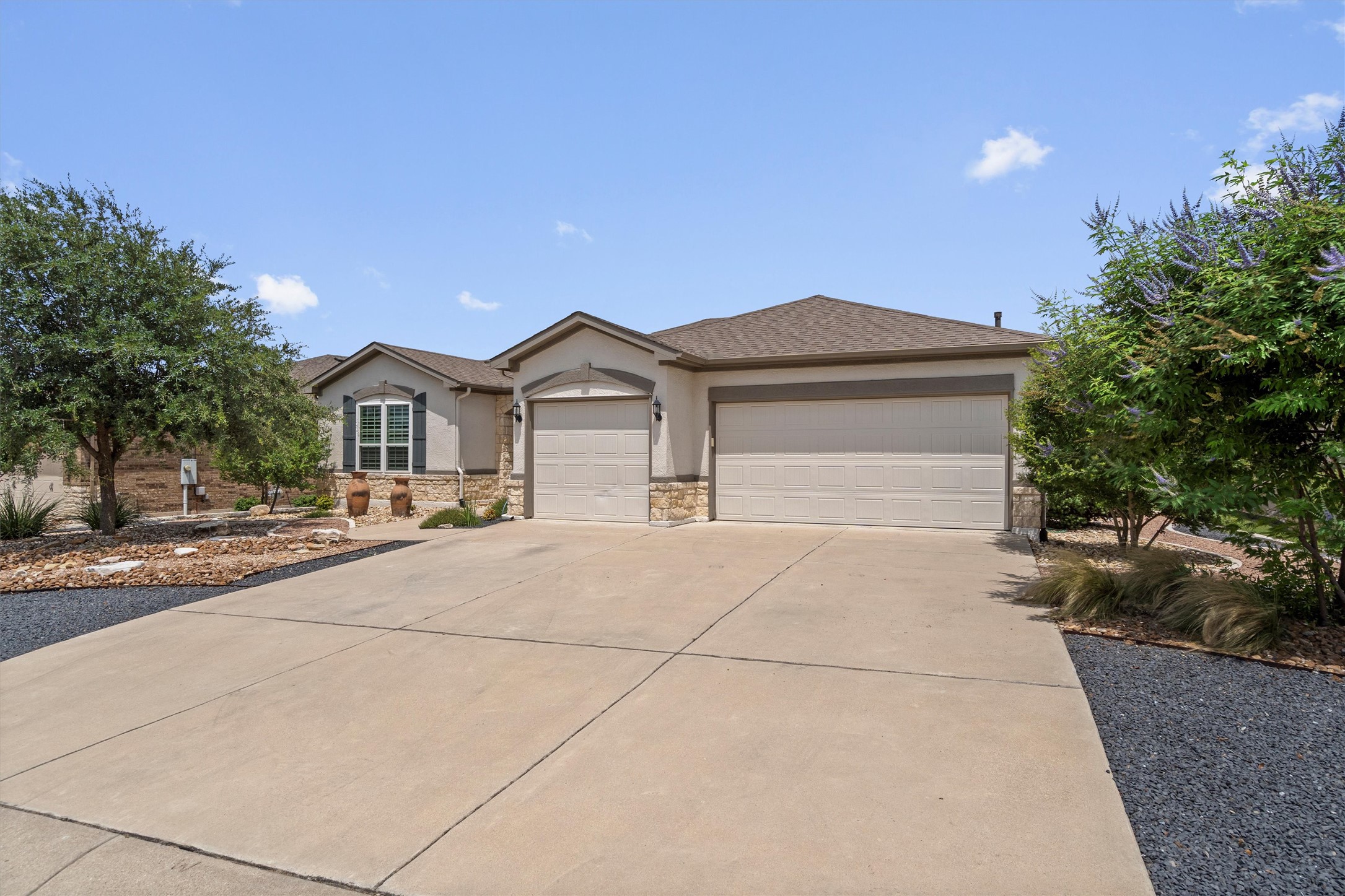 205 McKittrick Ridge Road Georgetown, TX 78633 - Photo 2 of 37 a front view of a house with a garden and garage