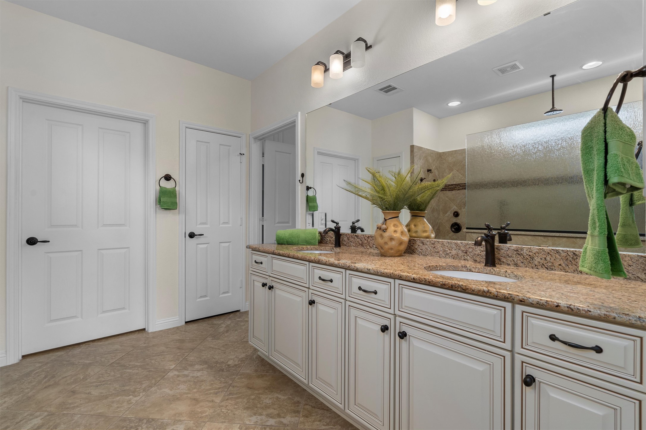 205 McKittrick Ridge Road Georgetown, TX 78633 - Photo 21 of 37 a bathroom with a double vanity sink and a mirror