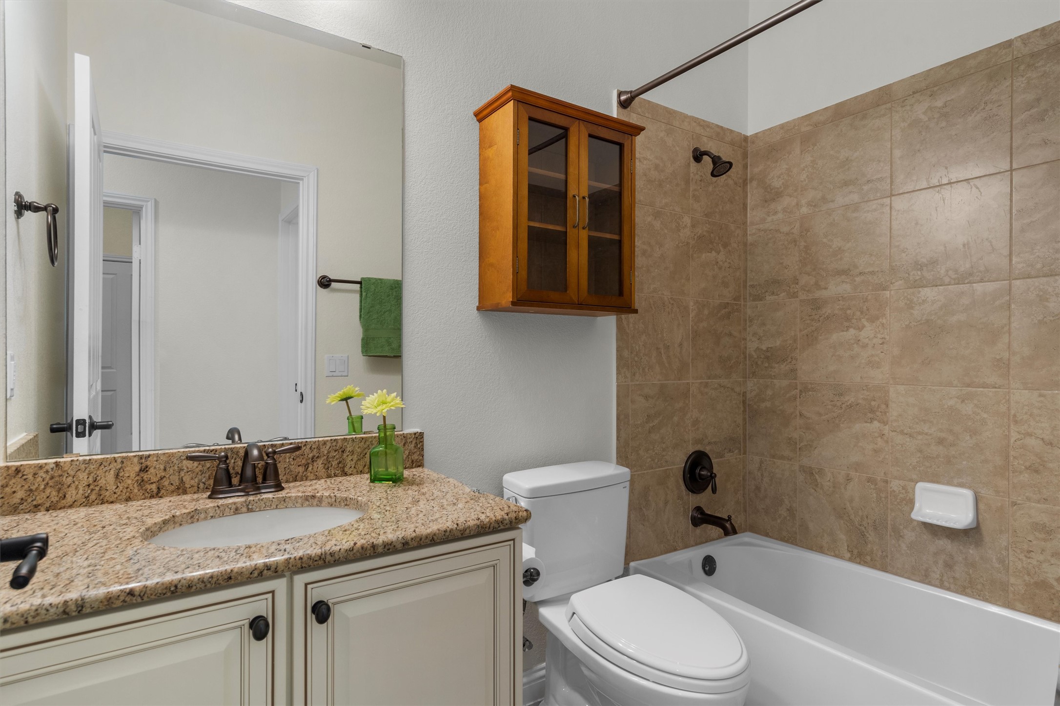 205 McKittrick Ridge Road Georgetown, TX 78633 - Photo 28 of 37 a bathroom with a granite countertop sink toilet and shower