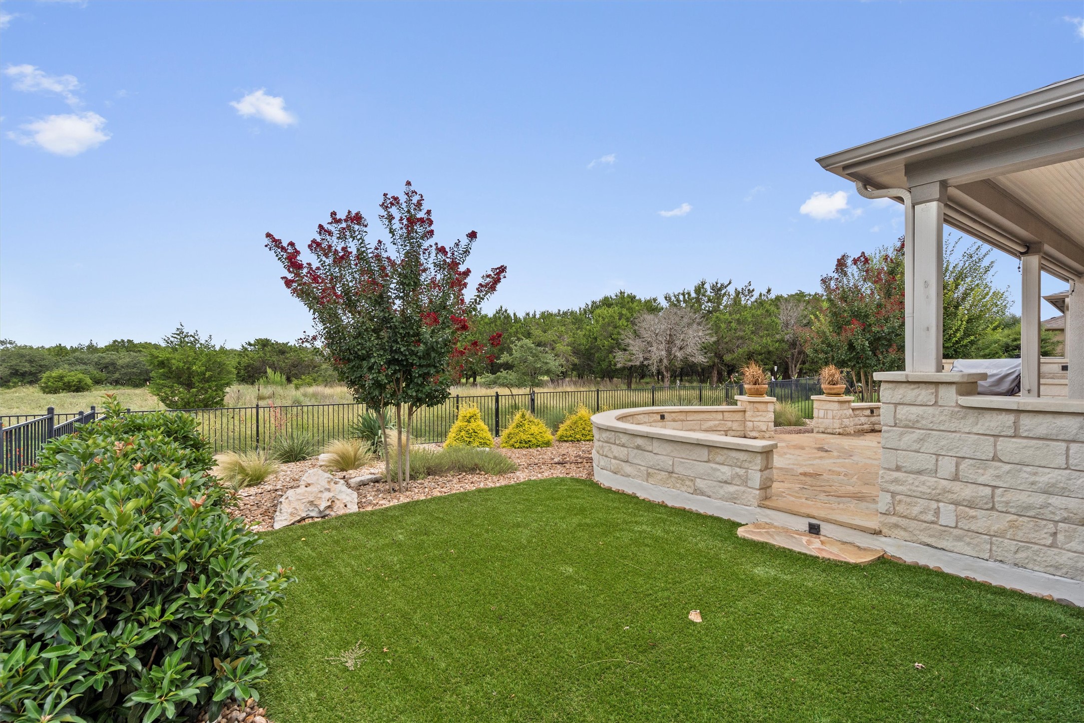 205 McKittrick Ridge Road Georgetown, TX 78633 - Photo 34 of 37 a view of a house with a backyard and a patio