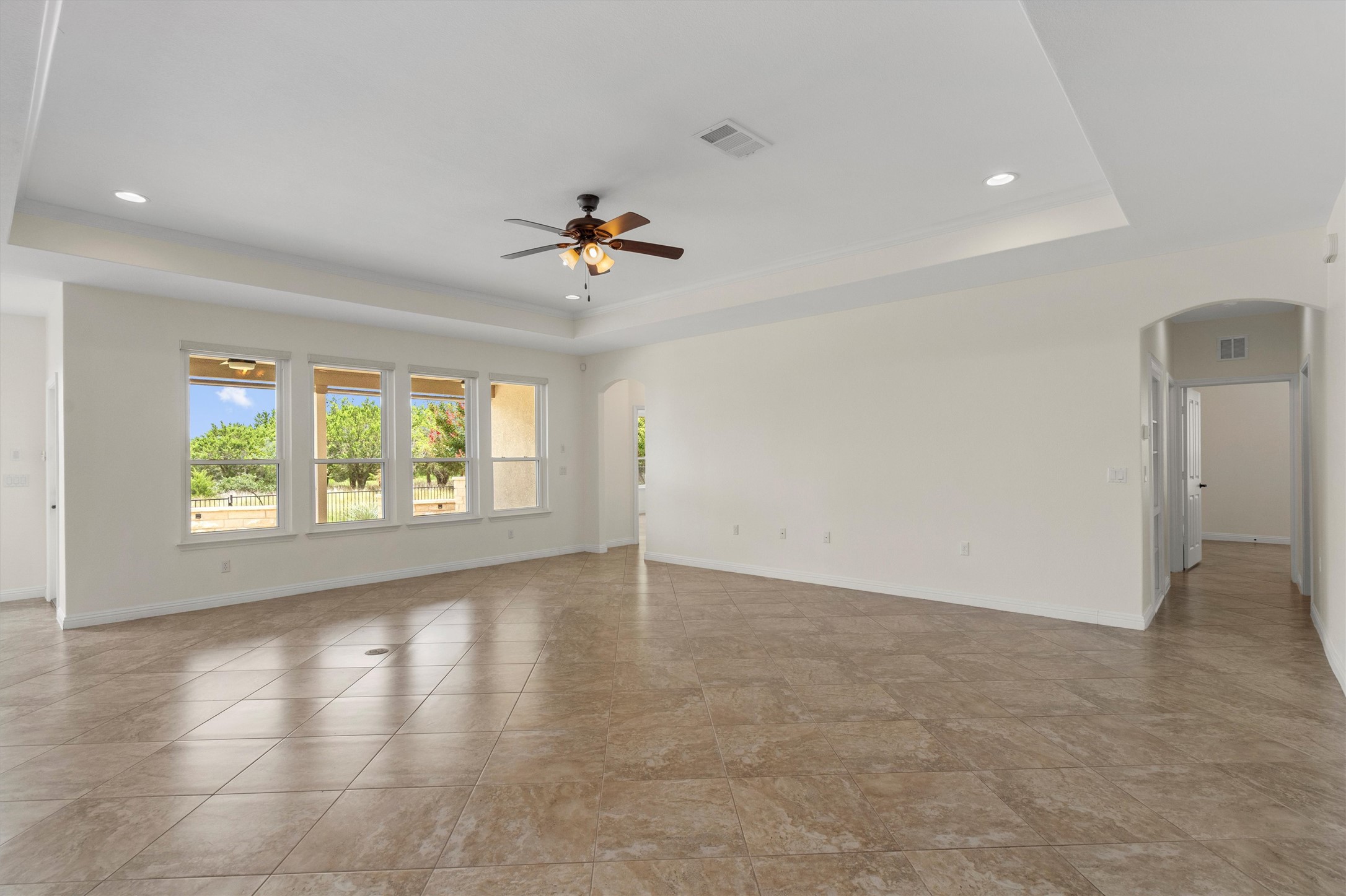 205 McKittrick Ridge Road Georgetown, TX 78633 - Photo 9 of 37 wooden floor in an empty room with a window