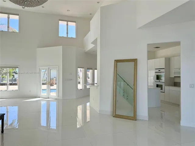 a view of a livingroom with wooden floor and a living room