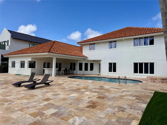 a backyard of a house with seating space