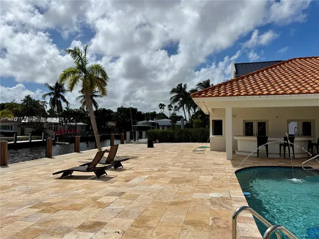 a view of a house with sitting area and entertaining space