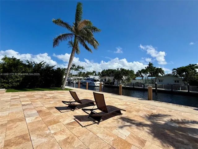 a view of a swimming pool with lounge chair