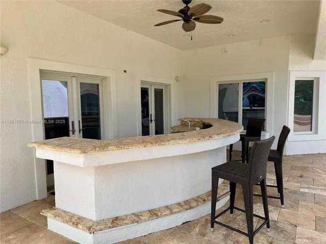 a view of dining table & chairs in a room