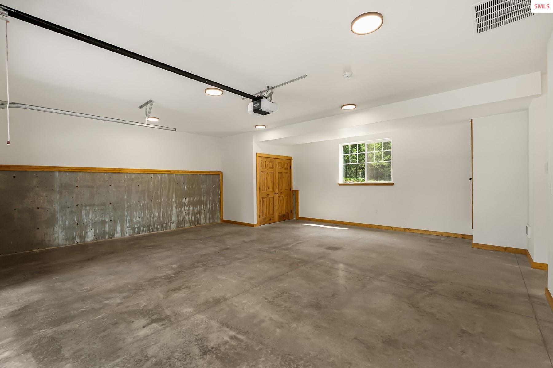 672 Hopkins Road Sandpoint, ID 83864 - Photo 52 of 61 This garage has room for work tables and storage solutions
