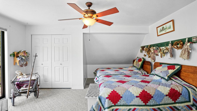 335 Jungfrau Hill Road Midway, UT 84049 - Photo 28 of 34 Bedroom with light colored carpet, ceiling fan, a closet, and vaulted ceiling