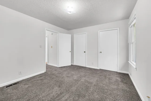 a bathroom with a sink toilet and mirror
