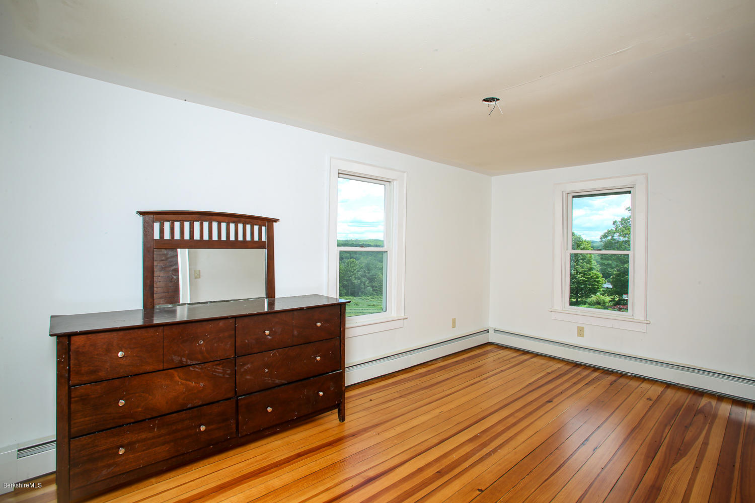 837 Murray Road Ashfield, MA 01330 - Photo 17 of 37 an empty room with wooden floor and a window