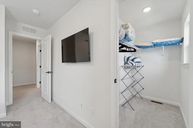 a view of a livingroom with furniture and white walls