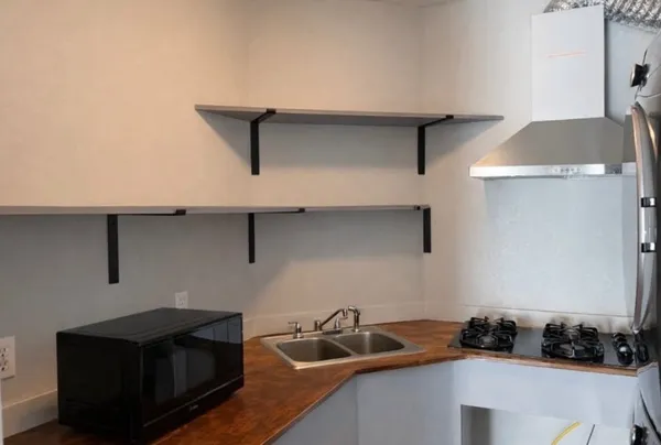 a kitchen with a sink and cabinets