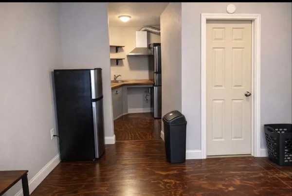a view of a kitchen with a refrigerator