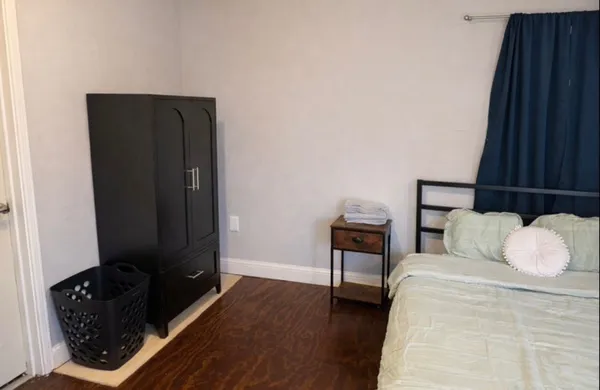 a bedroom with a bed and a closet