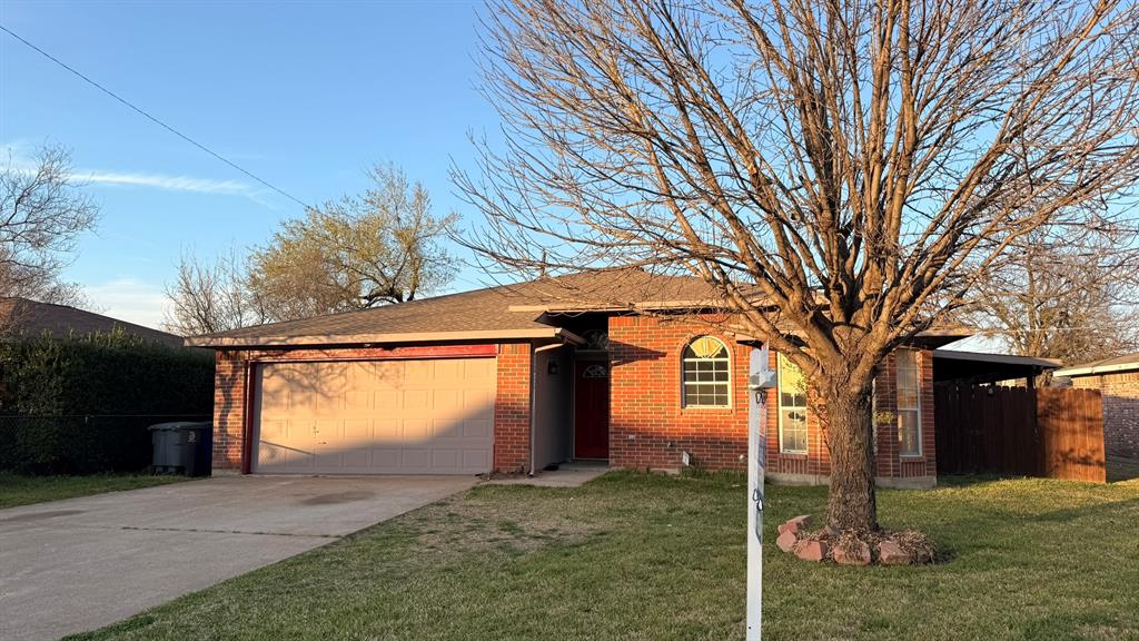 12259 Rim Rock Road Dallas, TX 75253 - Photo 1 of 17 Ranch-style home with brick siding, an attached garage, driveway, and roof with shingles