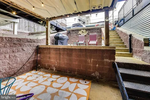 a bed room with furniture and a wooden floor