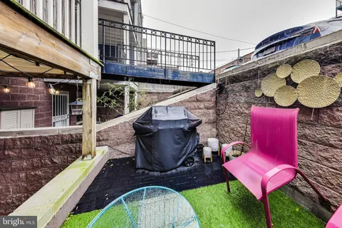 a view of a house with wooden deck