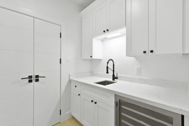 a bedroom with a bed couch and a window