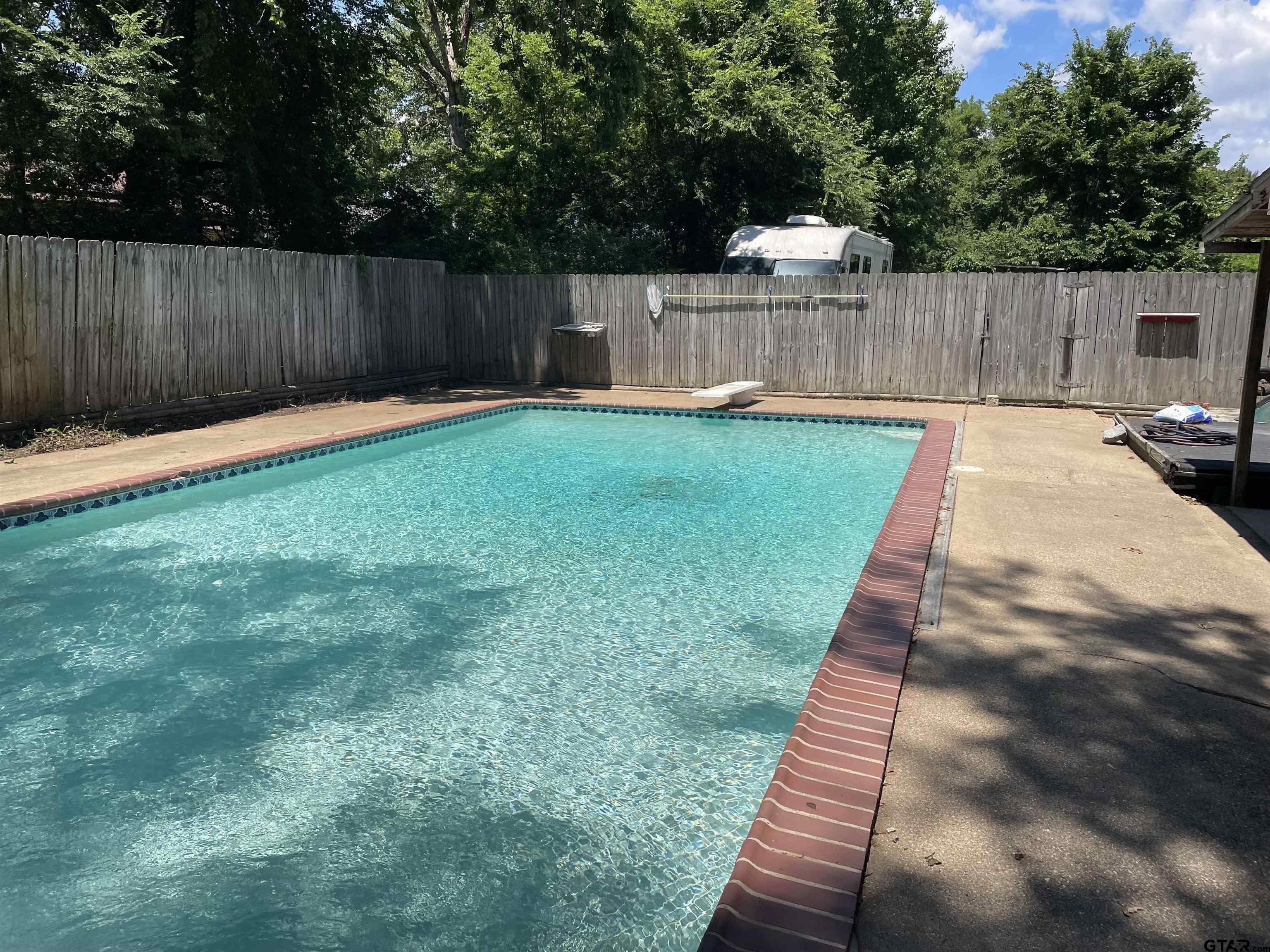 1302 Jeb Stuart Drive Tyler, TX 75703 - Photo 41 of 47 a view of a backyard with a small cabin