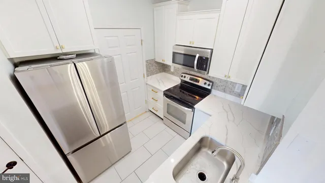 a bathroom with a sink and mirror