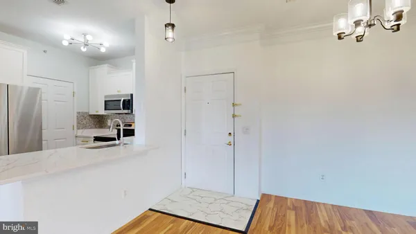 a view of a kitchen from the hallway