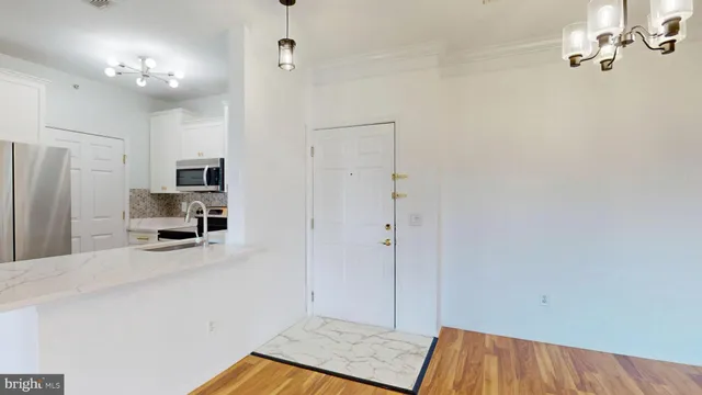a view of a kitchen from the hallway