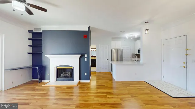 a view of empty room with a fireplace